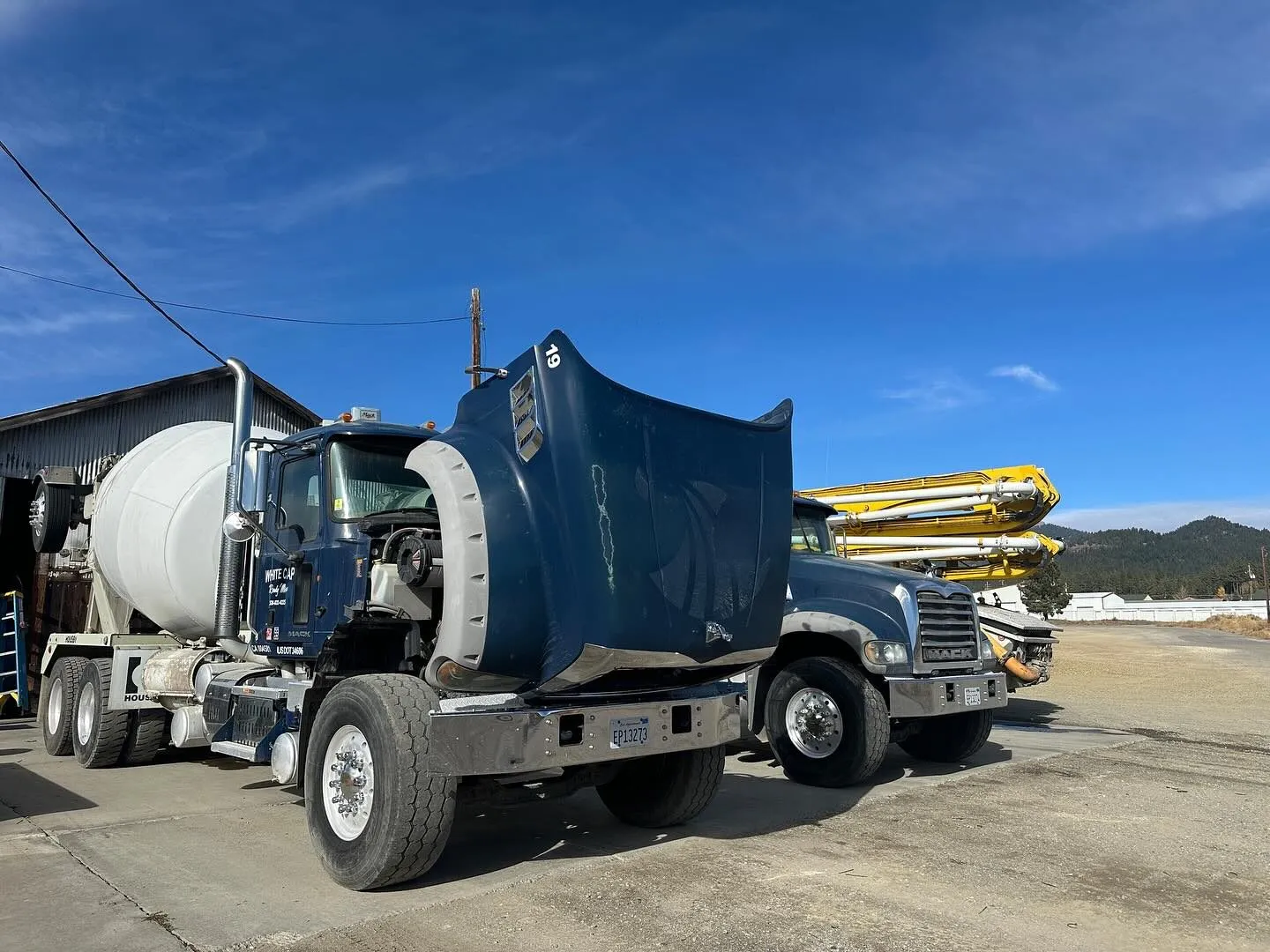 Mack concrete mixer truck with hood raised during mobile CARB Clean Truck Check testing