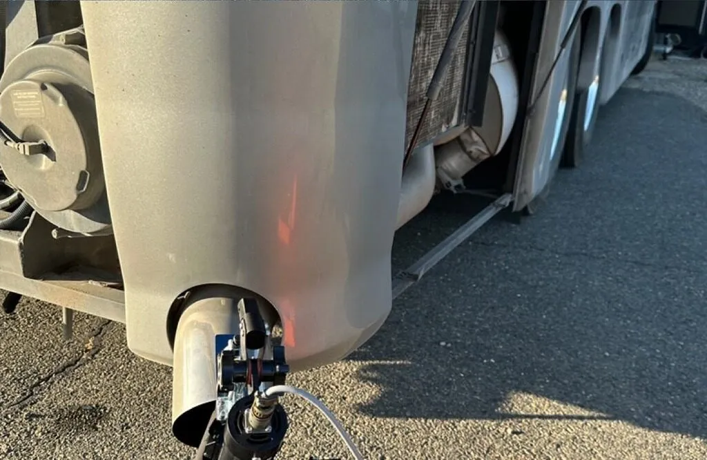 OVI opacity test probe inserted into a diesel truck exhaust stack during smoke opacity inspection